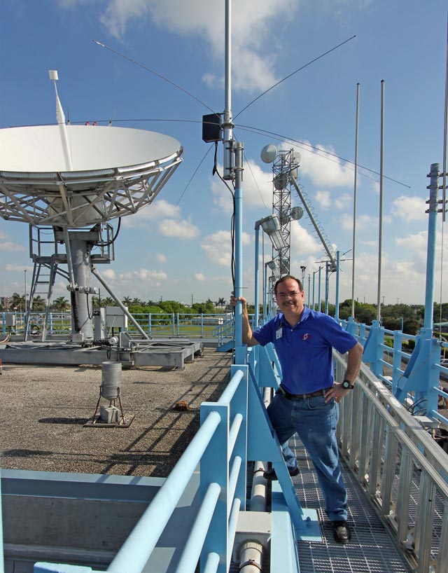 WX4NHC Assistant Coordinator Julio Ripoll-WD4R Inspecting Antennas on Top of the NHC WX4NHC Assistant Coordinator Julio Ripoll-WD4R Inspecting Antennas on Top of the NHC